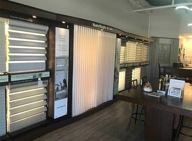 Store interior showcasing several different types of window coverings